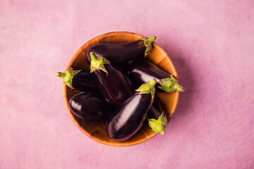 Eggplants in a wooden bowl