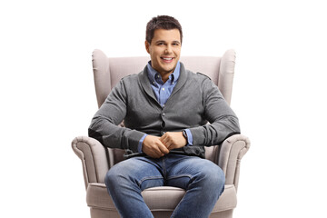 Young man sitting in an armchair