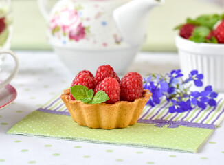 raspberry tart cake on a table