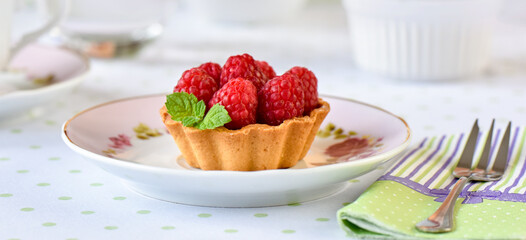 raspberry tart cake on a table