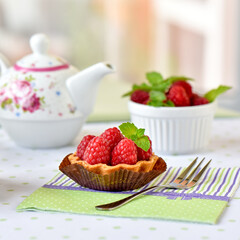 raspberry tart cake on a table