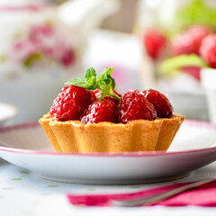 raspberry tart cake on a table