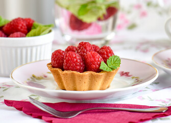 raspberry tart cake on a table