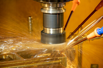 The CNC milling machine cutting the  mold parts with oil coolant method.