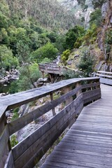 Fototapeta na wymiar Arouca Geopark, wooden walkway on the bank of Paiva River, in the hydrographic basin of the Douro River
