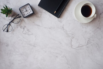Cropped shot view of office desk table office equipment, labtop, tablet and other office supplies on the modern space, flat lay.