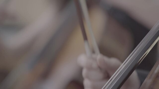 woman playing the cello in band