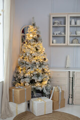 Christmas tree with garland. New Year home decor