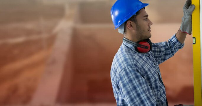 Animation of caucasian worker in blue hard hat with spirit level at construction site