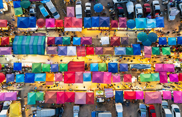 View of aeriel Market with colorful tents in night time. Night Market in Thailand.