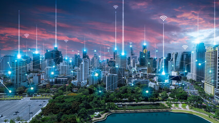 City scape with connecting dots for networking and communication in twilight. Internet...