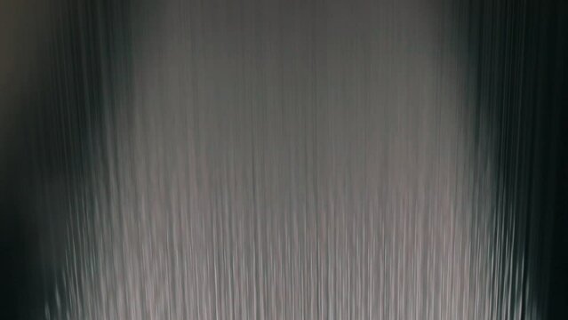 Large roll of synthetic winterizer. Syntepon manufacturing process. Industrial interior.