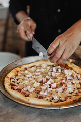 chef baker making pizza at kitchen.