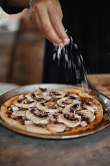 chef baker making pizza at kitchen.