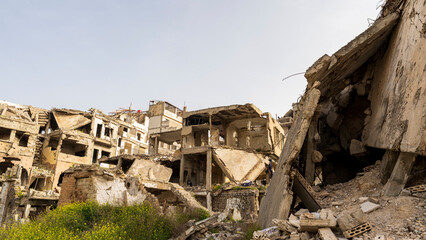 Fototapeta na wymiar Civil war ruins of Homs, Syria. Homs is the most devastated large city in Syria, where whole districts are in ruins and empty of people.
