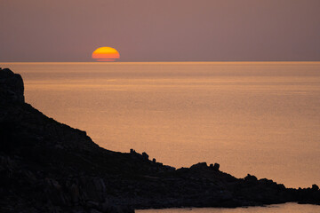 sunset in a rocky beach