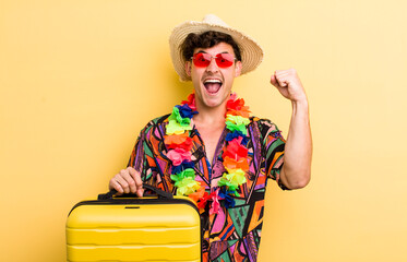 young handsome guy shouting aggressively with an angry expression. summer holidays concept