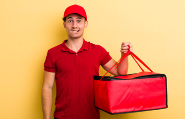 young handsome guy looking puzzled and confused. pizza delivery concept