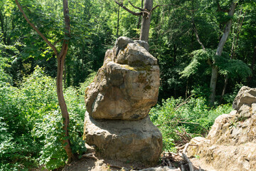 Fototapeta na wymiar rock buddha statue in the forest travel nature hiking