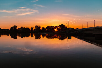 Beautiful sunset with reflections near Plattling, Isar, Bavaria, Germany