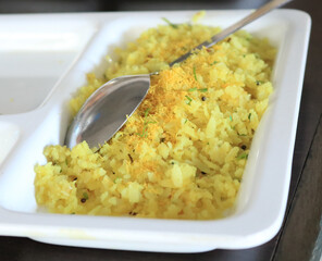 pohe or poha is flattened rice. kande pohe is a frequent breakfast of maharashtrian people. Pohe is also eaten in other parts of central India.
