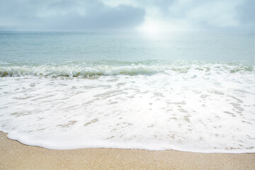 Fototapeta na wymiar Splashing sea waves on sunny day.Summer vacation background.