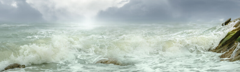 Beautiful shot of seascape with splashing sea waves on sunny day.Summer vacation background.