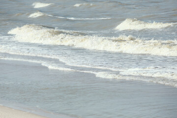 Soft focus and tone of sea wave on the sandy beach.Summer vacation background.