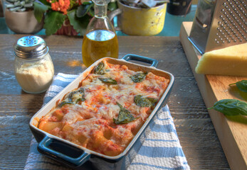 Side View of Baked Rigatoni on natural wood surface