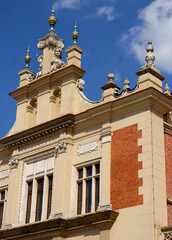 facade  Cloth Hall building with mascarons of top roof