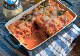 Top View of Baked Rigatoni on natural wood surface