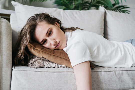 The girl was tired and lay down to rest.