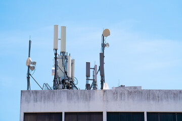 Telecommunication base station network repeater antenna on top of the building. 4G & 5G antenna
