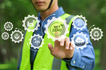 Net zero and carbon neutral concept.NET ZERO icons and symbols save the eco world and reduce pollution. environmental engineering touching green net zero icon and green icon on a green background. - obrazy, fototapety, plakaty