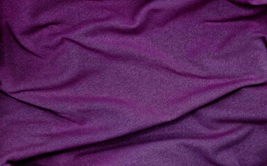 crumpled purple sackcloth texture use as backgrounfd. natural mood of cloth texture. close up of coarse fabric for backdrop in luxury mood. creases on fabric with blank space for design.