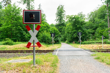 railway crossing sign path track in forest nature