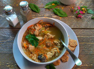 Top View Of Chicken and Rice Soup on natural wood surface.