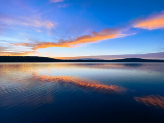 Colorful Sunset Over Water with Clouds