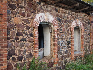 Beautiful stonework. The ruins of the old outbuildings of the estate of the Wrangel barons in the village of Torosovo. Volosovsky district, Leningrad region, Russia.