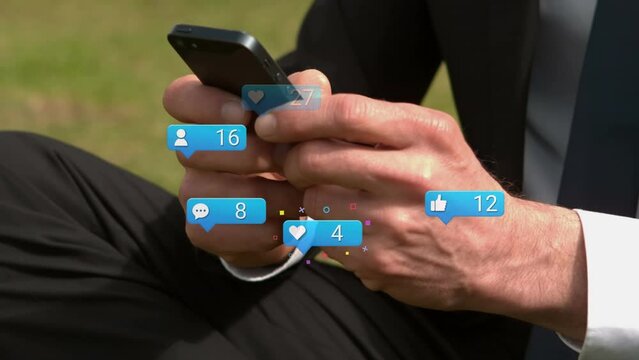 Speech bubbles with increasing numbers against mid section of businessman using smartphone