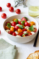 Salad with mozzarella, tomatoes and basil. Healthy eating. Vegetarian food.