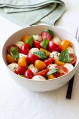 Salad with mozzarella, tomatoes and basil. Healthy eating. Vegetarian food.