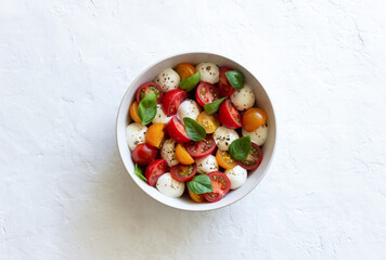 Salad with mozzarella, tomatoes and basil. Healthy eating. Vegetarian food.