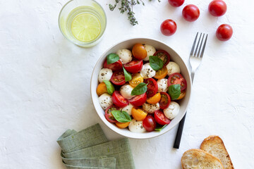 Salad with mozzarella, tomatoes and basil. Healthy eating. Vegetarian food.