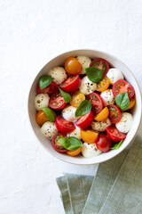 Salad with mozzarella, tomatoes and basil. Healthy eating. Vegetarian food.