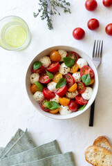Salad with mozzarella, tomatoes and basil. Healthy eating. Vegetarian food.