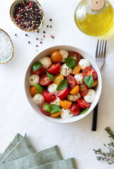 Salad with mozzarella, tomatoes and basil. Healthy eating. Vegetarian food.