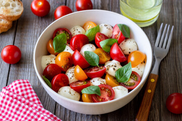 Salad with mozzarella, tomatoes and basil. Healthy eating. Vegetarian food.