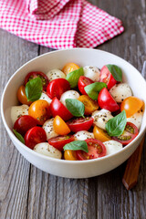 Salad with mozzarella, tomatoes and basil. Healthy eating. Vegetarian food.