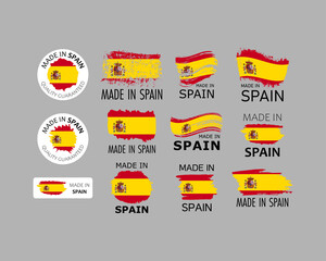 Set of stickers. Made in Spain. Brush strokes shaped with Spanish flag. Factory, manufacturing and production country concept. Design element for label and packaging. Vector colorful illustration.